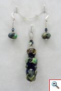 Pendant set black vessel with blue/green/tan swirls